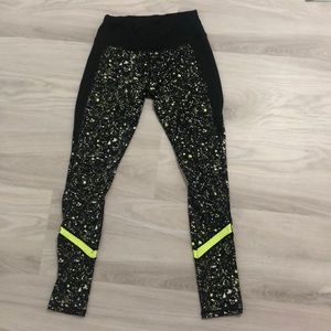 Black and green athletic pair of leggings